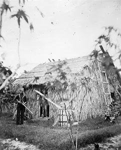 William Lanehart standing in front of his shack